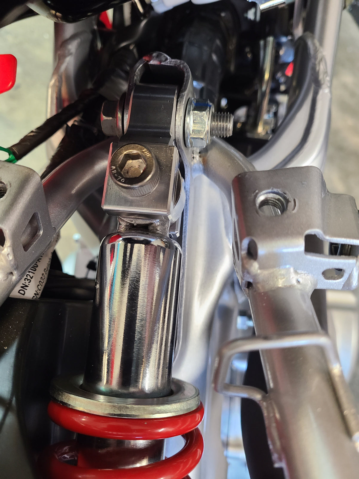 CRF110 REAR SHOCK EXTENDER
