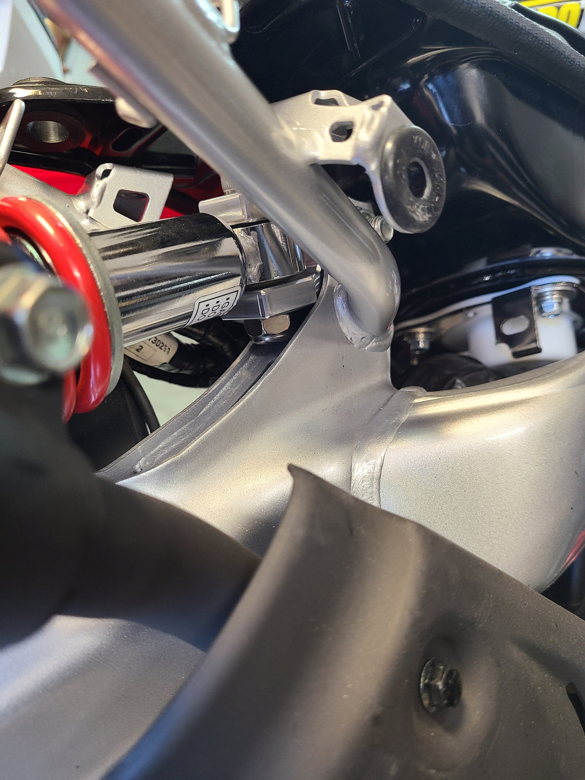 CRF110 REAR SHOCK EXTENDER